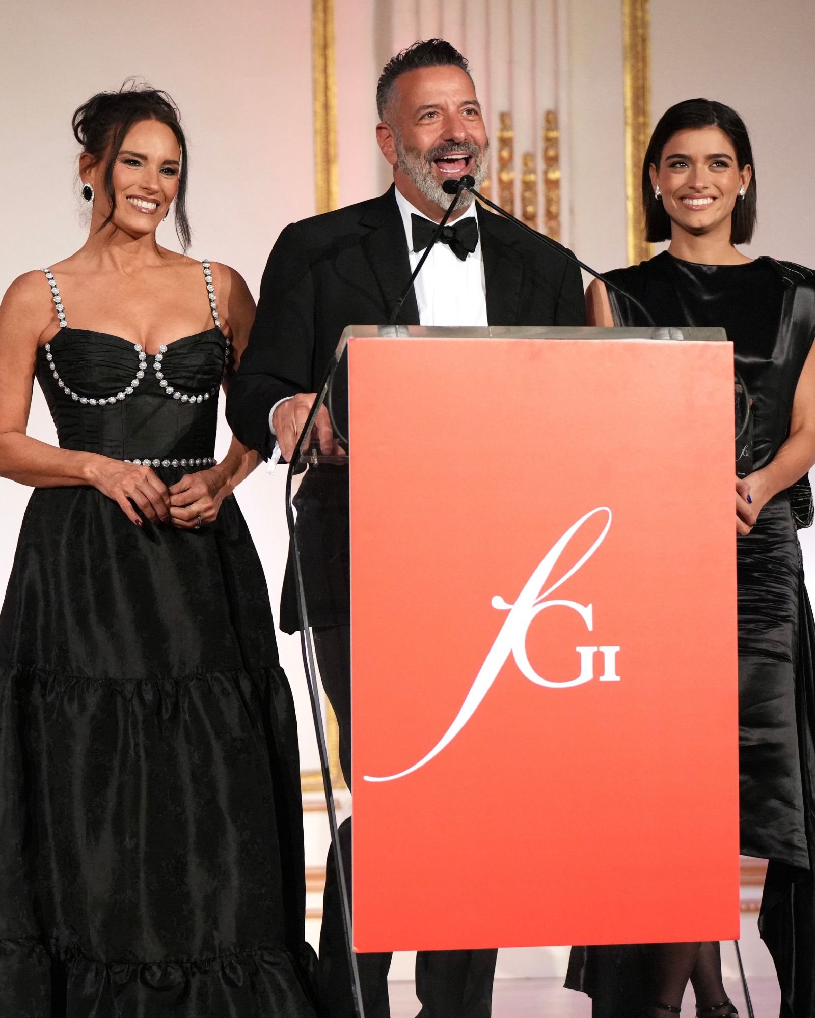 Heidi, Marc and Dixie D'Amelio on stage at the FGI Night of Stars